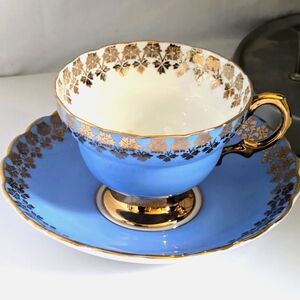 Rosina Bone China Footed Teacup and Saucer Periwinkle Blue Gold Flowers Vintage